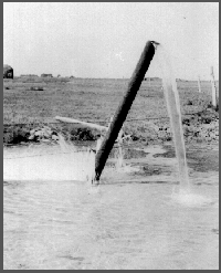 Artesian well, location is possibly near Fremont, Nebraska.